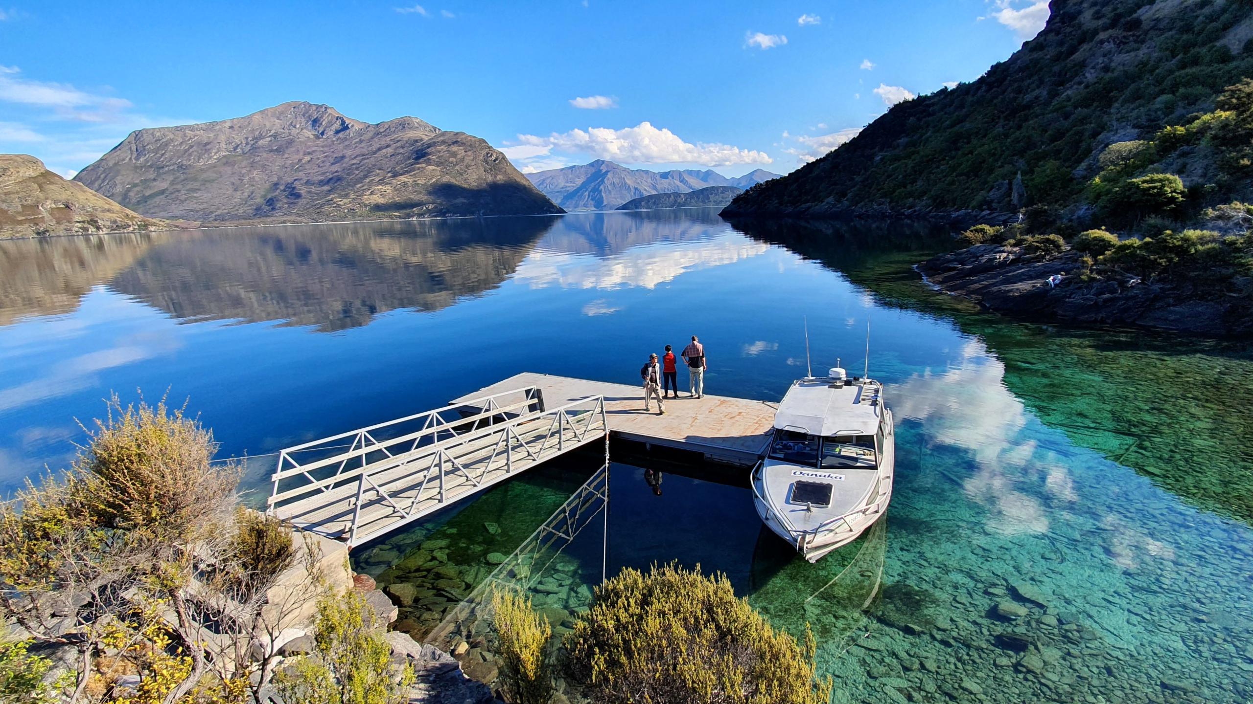 EWA Boat at Mou Waho Jetty crystal clear emerald water