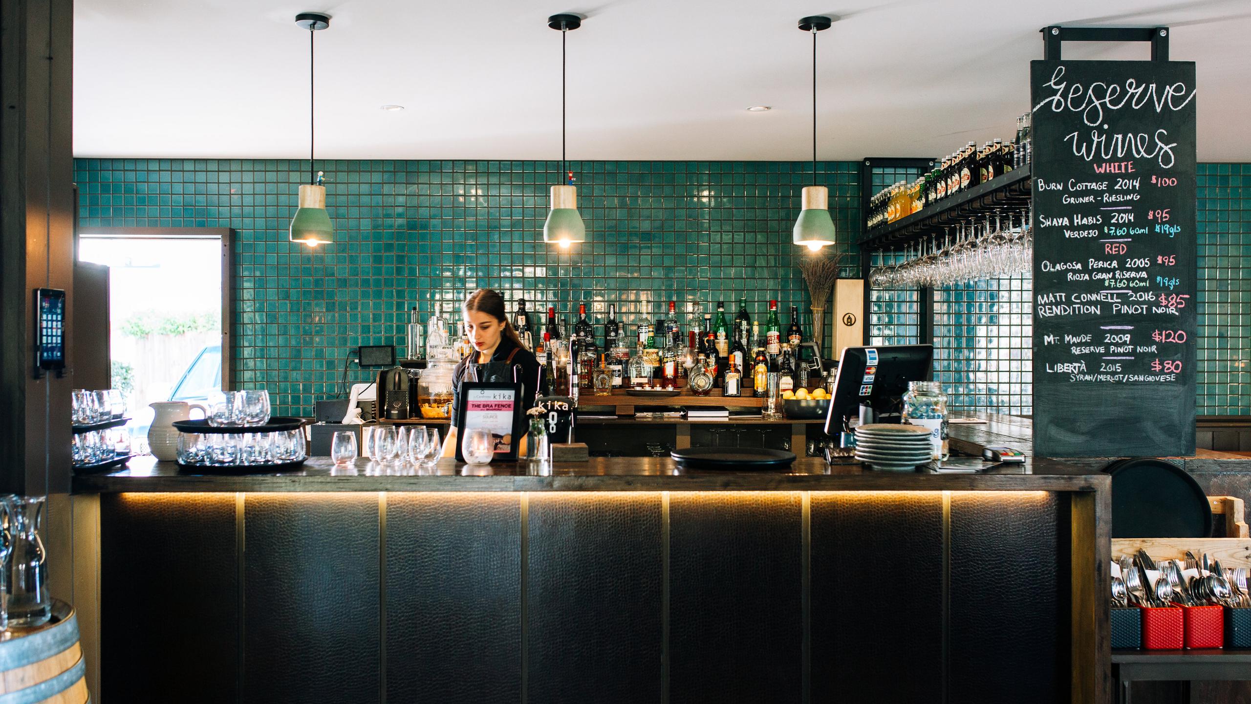 woman behind bar